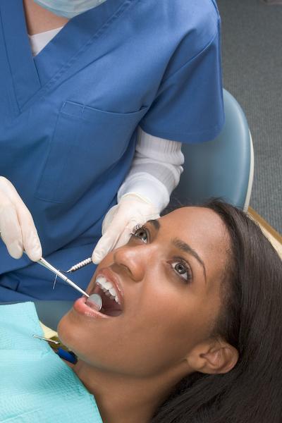 A woman receiving a dental exam