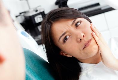 A woman with tooth pain