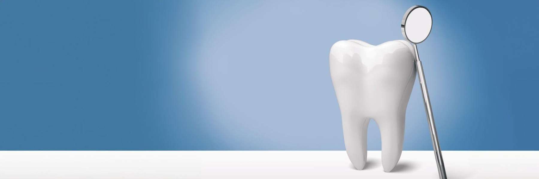 An illustration of a tooth and a dental mirror