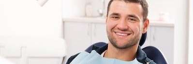 A man sitting in the dentist's office