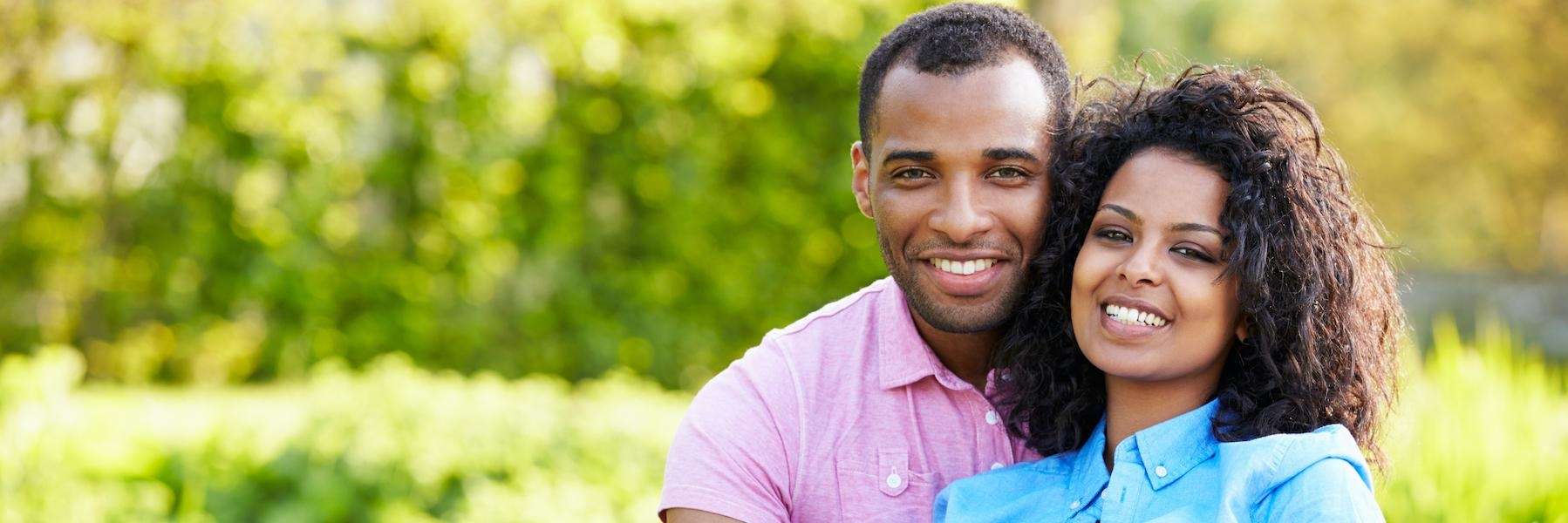 A couple smiling outdoors | dentist Elk Grove