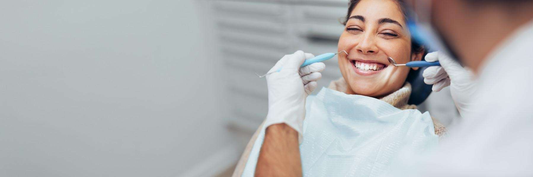 A woman receiving a dental exam