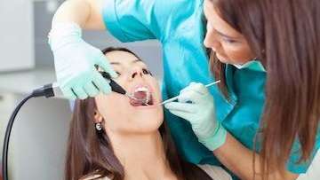 A woman getting a dental cleaning