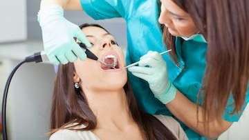 A woman getting a dental cleaning