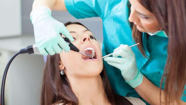 A woman getting a dental exam