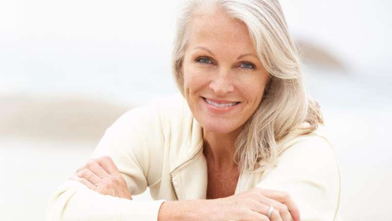 A smiling older woman | elk grove dentist