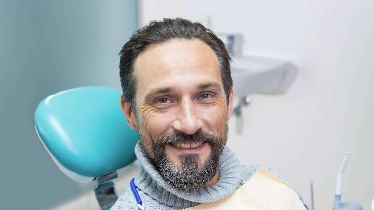 A smiling man in the dentist's chair | dentist in Elk Grove, CA
