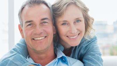 A woman and man hugging | dentist Elk Grove