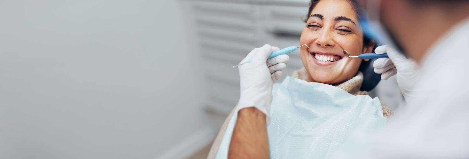 A woman receiving an oral exam