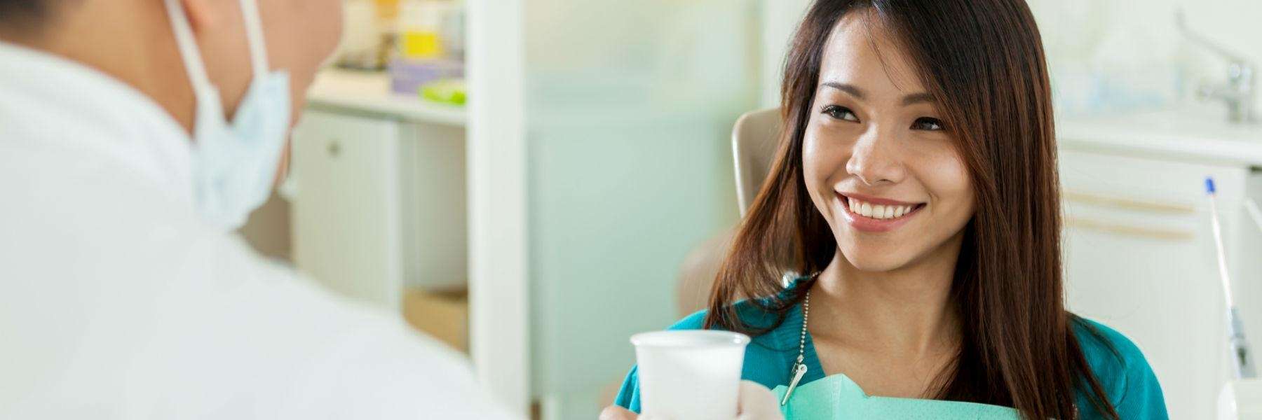 A woman receiving a dental exam